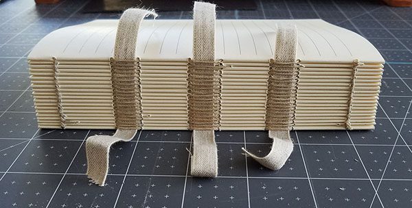 case binding sewn onto raised linen tapes for support bookbinding