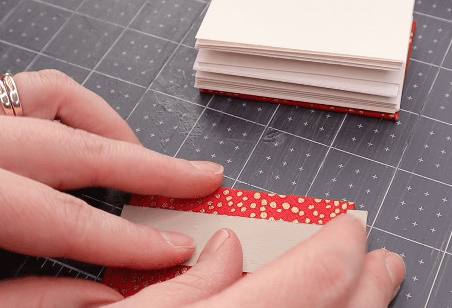 piercing sewing stations in the boards of the coptic bindings