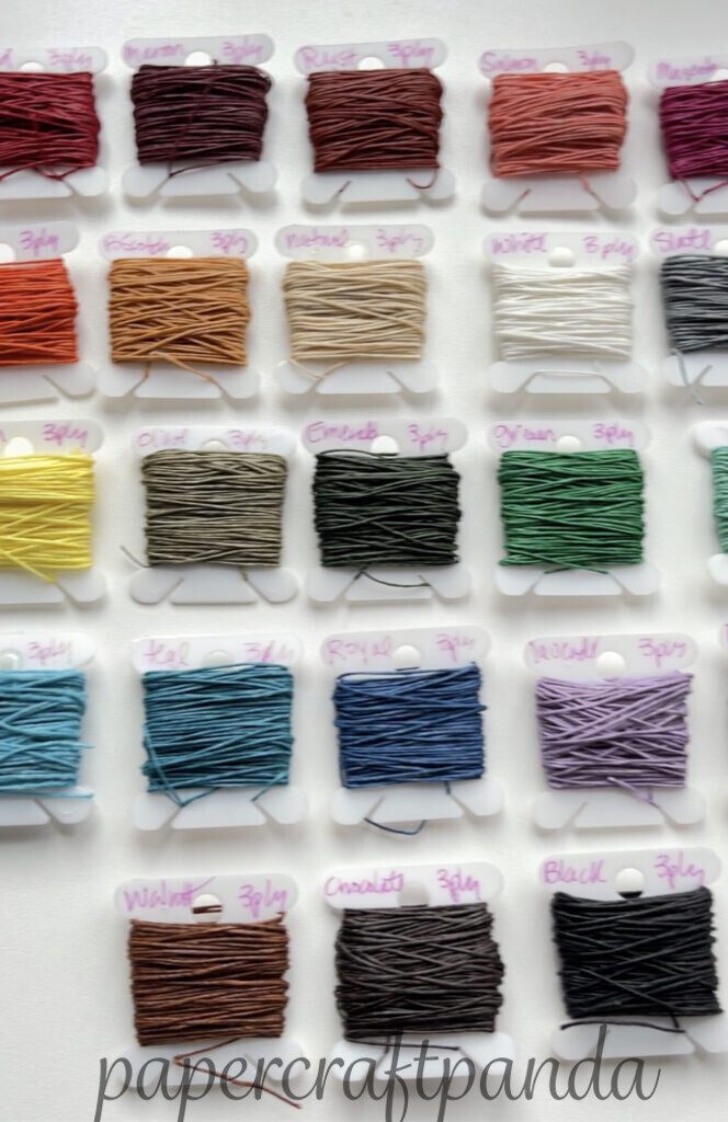 two images of waxed linen thread, one showing rows of various colors and the other showing a red thread laying on top of coordinating papers