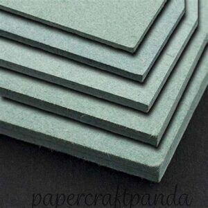 stack of green millboard book board image by talas online