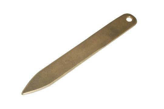 a single brass bone folder on white background