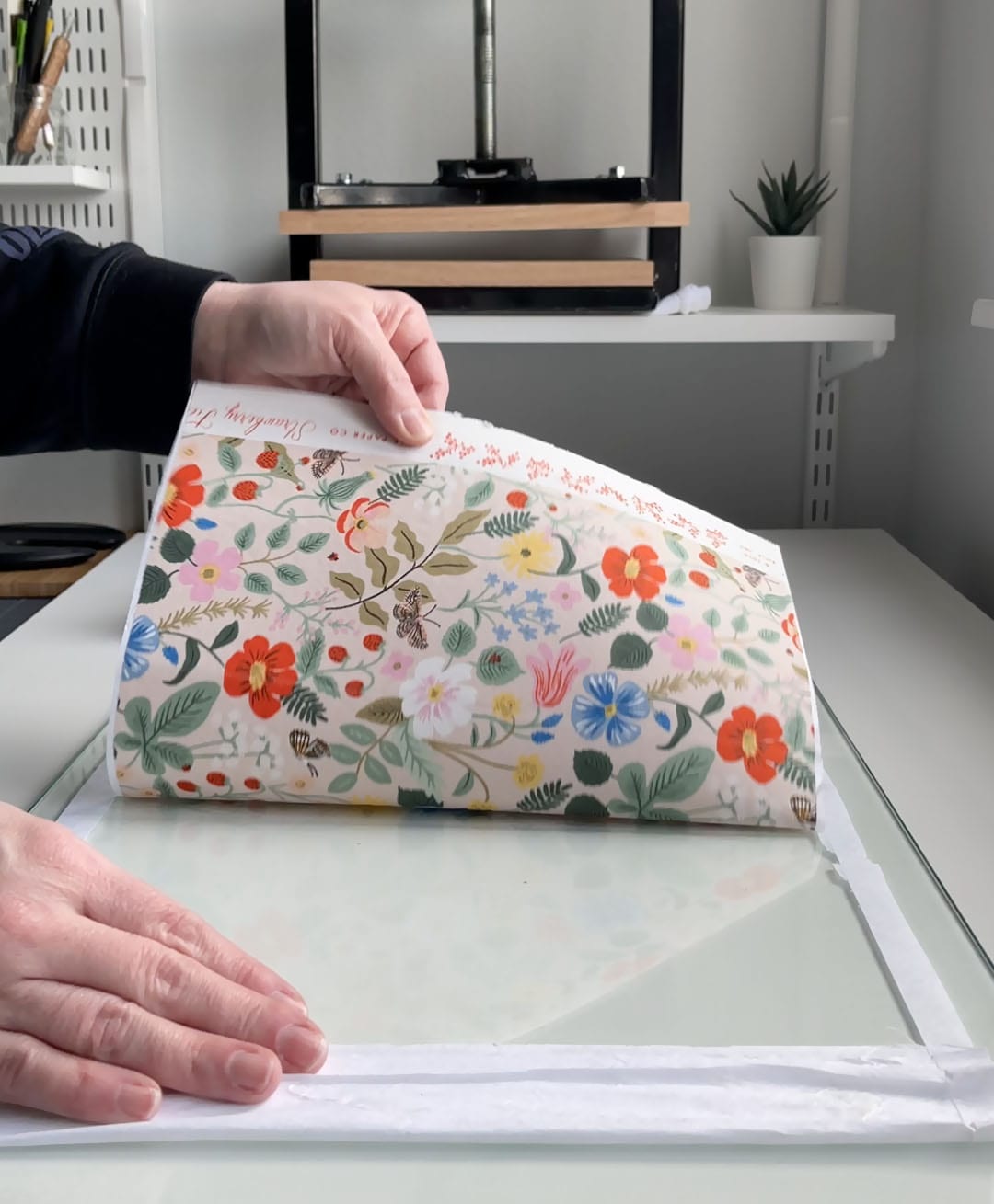 remove finished book cloth from the glass surface