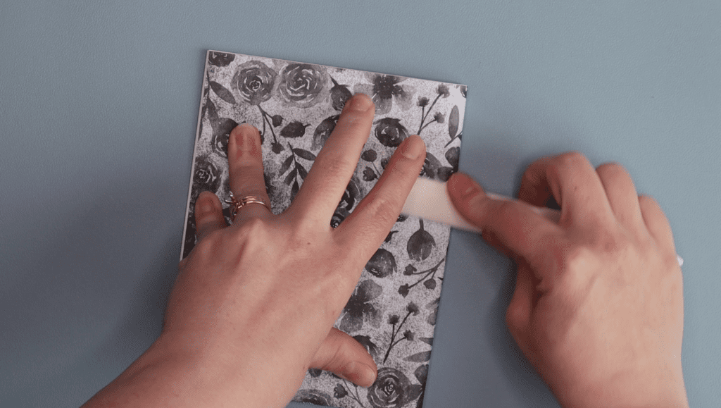 folding 6 hole pamphlet bookbinding smoothing crease with a bone folder