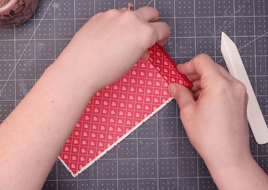 several images showing the process of gluing the end papers to the covers as a final step