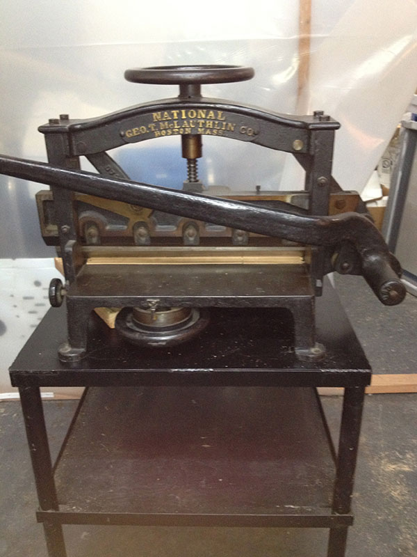 swing arm guillotine used for bookbinding