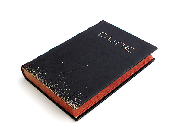 dune rebinding by holly doench of black oak bindery lay flat front cover with edge gilding and spice