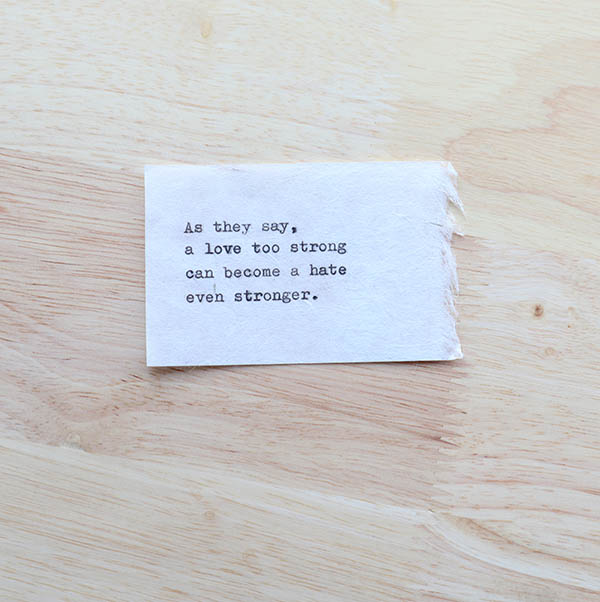 typewriter verse on a piece of of organic paper for a weathergram on wood background